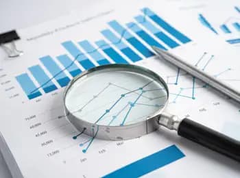 magnifying glass over a graph